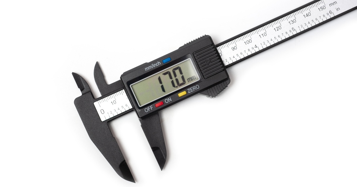 A digital caliper resting on a white background. The screen has red, yellow, and blue buttons and reads 17.0 millimeters.