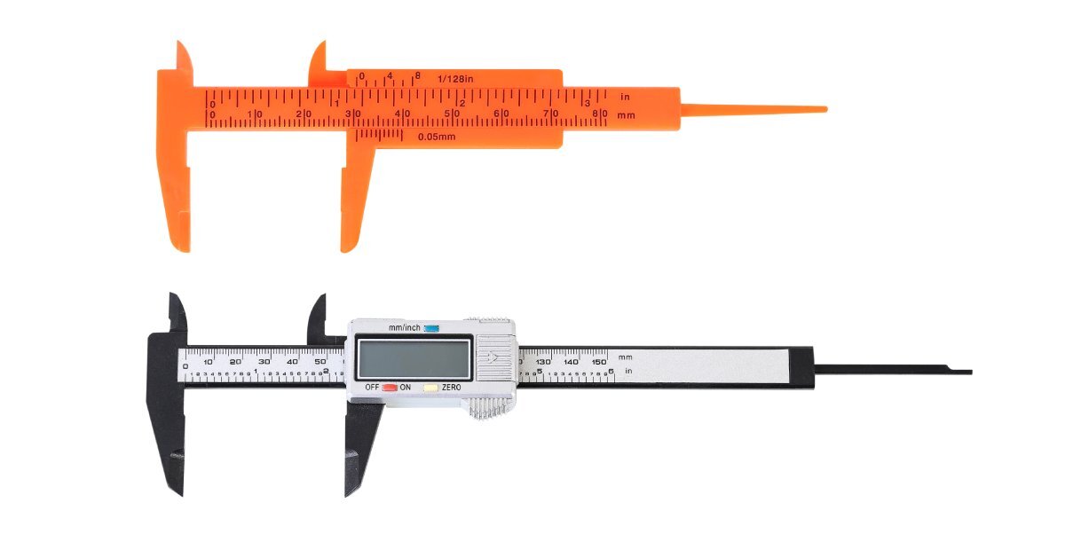 An orange vernier caliper and a metal digital caliper resting on a white background beside each other.